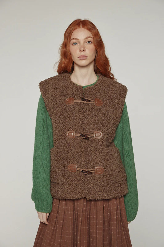 Reversible toggle button vest